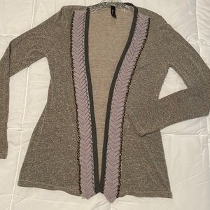 Light cardigan or shrug. Made by Boutique and has beautiful details.